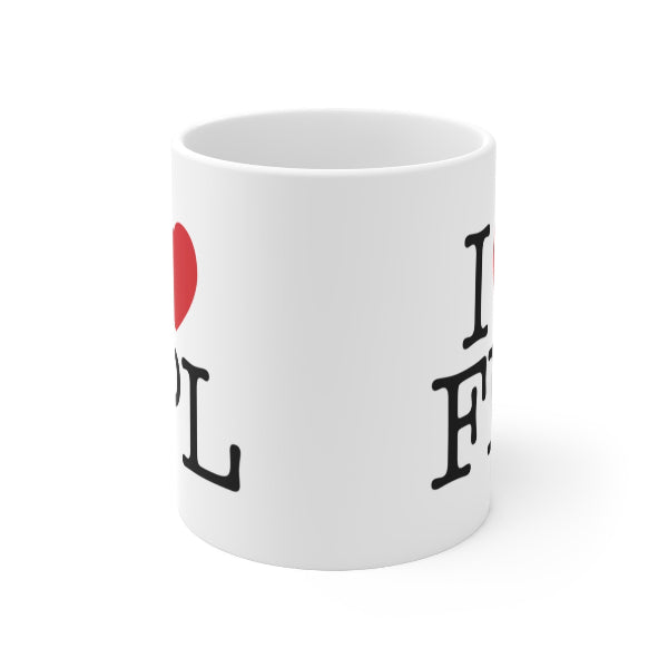 White mug with 'I ❤️ L ❤️ E ❤️' text on a white background