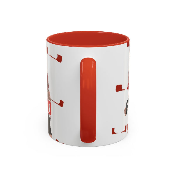 White mug with red interior and handle, featuring hockey-themed graphics on a white background