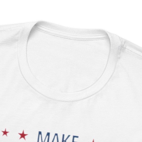 White t-shirt with 'MAKE' text and red stars on a white background