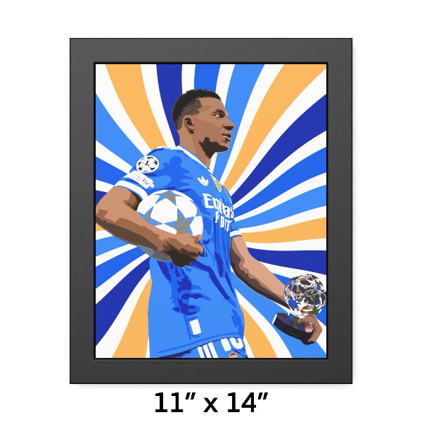 Framed artwork of a soccer player holding trophies with a colorful sunburst background.