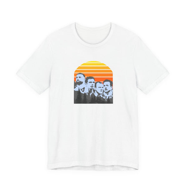 White t-shirt with a graphic design of four people in front of a sunset on a white background