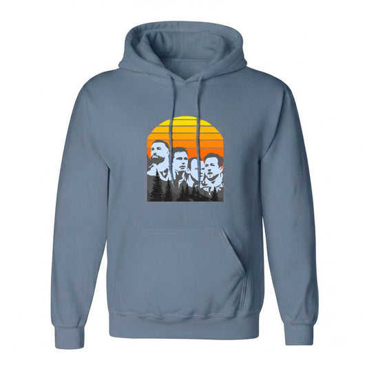 A slate blue pullover hoodie with a front kangaroo pocket and a graphic print of four men's faces in black and white set against a retro orange and yellow sunset on the chest.