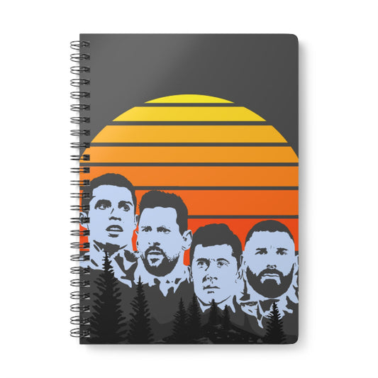 Notebook with a sunset design and silhouettes of four men on the cover