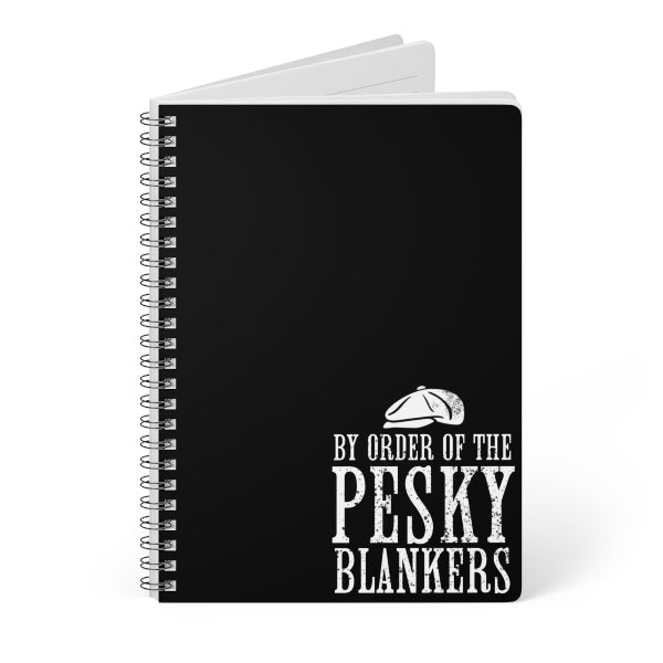Black notebook with white text and design on a white background