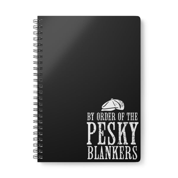 Black notebook with white text and design on a white background