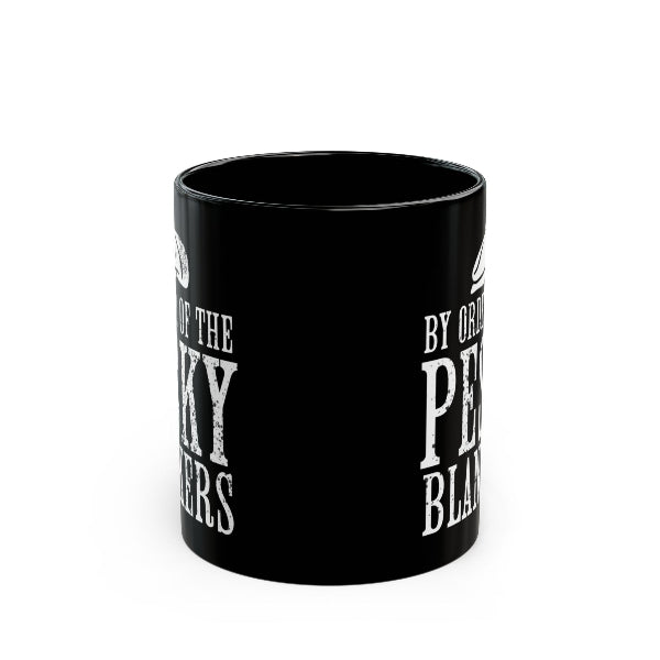 A black ceramic mug with distressed white text reading 'By Ordinance of the Peculiar Blacks of America' on a plain white background.