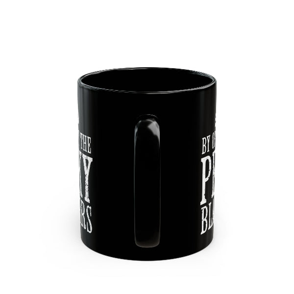A black ceramic mug with a glossy finish, featuring white distressed text on the side, shown against a plain white background.