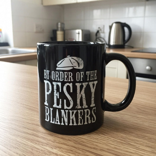 Black mug with white text on a kitchen counter