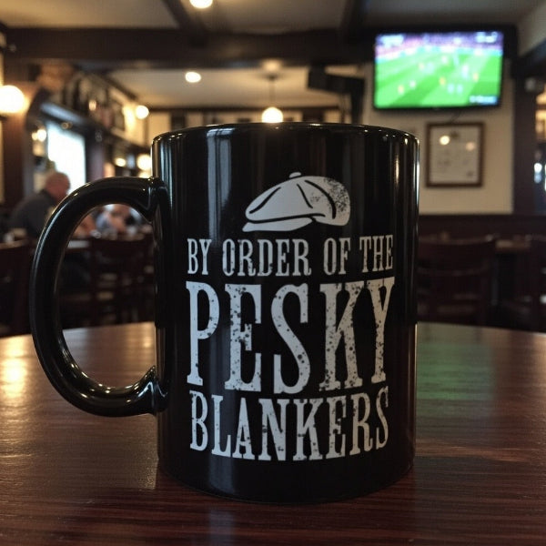 Black mug with humorous text on a bar counter