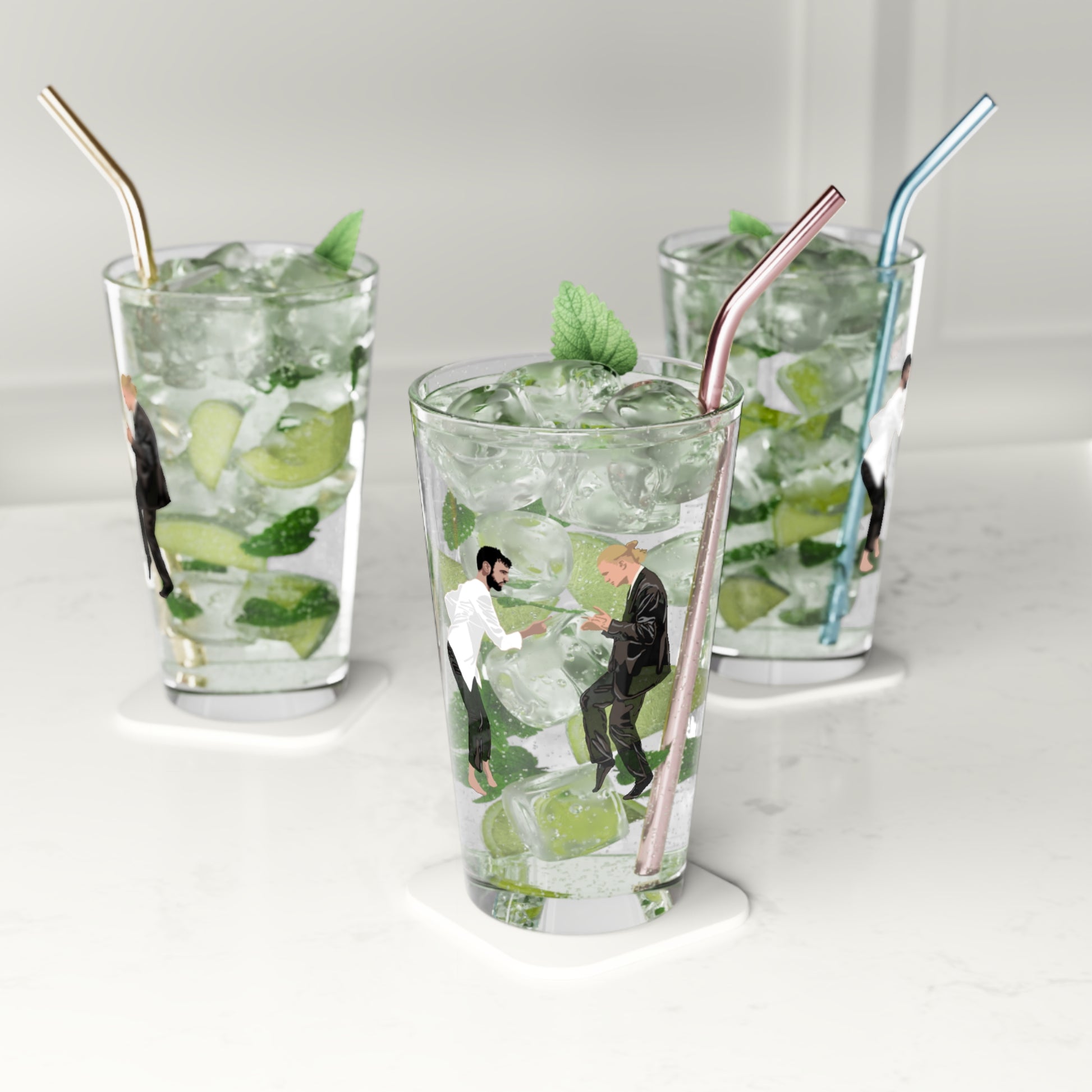 Three glasses of mojito with straws on a white background