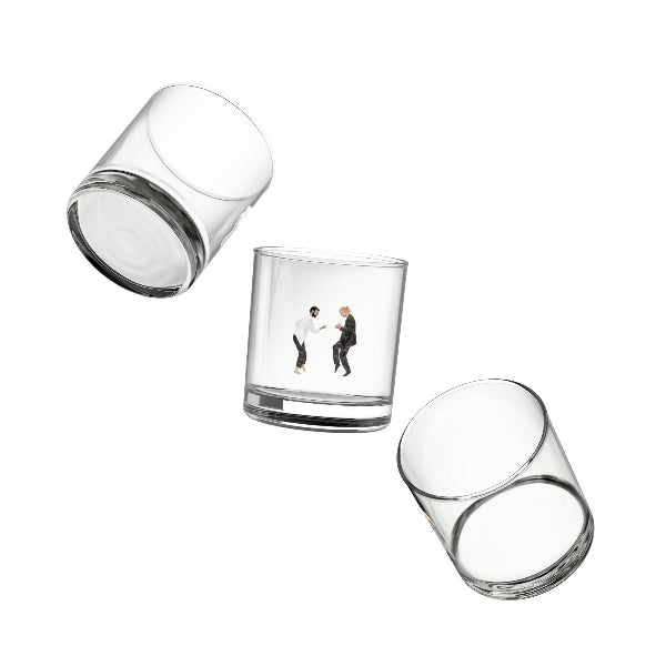 Set of three clear glass tumblers on a white background