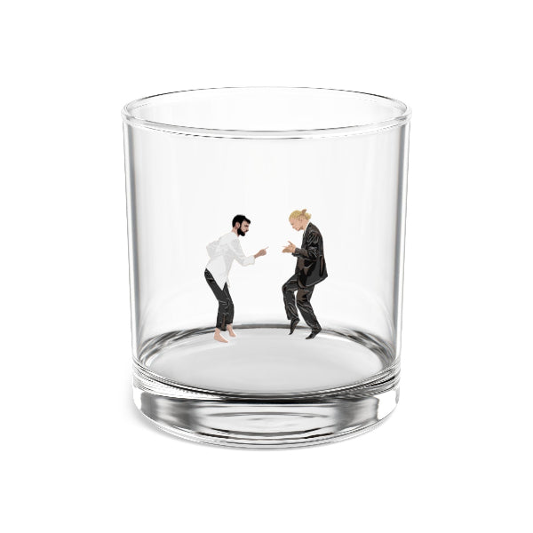 Clear glass with figurines of two people shaking hands inside on a white background