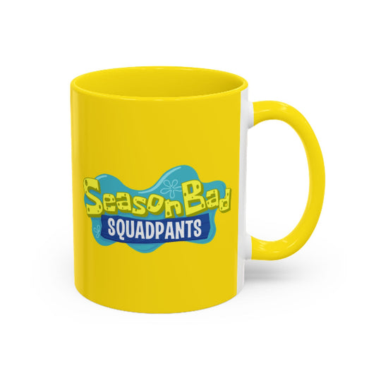 Yellow mug with 'SeasonBad Squadpants' text on a white background