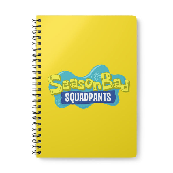 Yellow notebook with 'SeasonBad Squadpants' text on a white background
