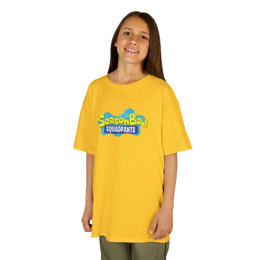 Child wearing a yellow 'Seasonbad Squadpants' t-shirt on a white background