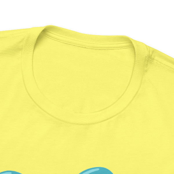 Close-up of a bright yellow crewneck t-shirt showing the inner collar and the top of a light blue graphic design at the bottom.