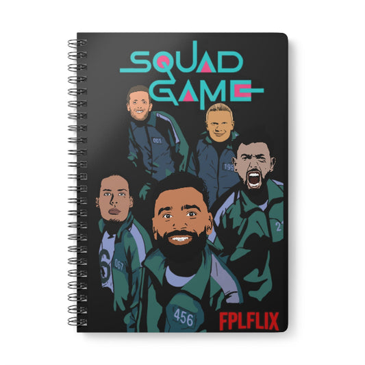Notebook with illustrations of people and 'Squad Game' text on a black background