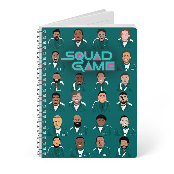 Notebook with 'Squad Game' design featuring illustrated faces on a green background