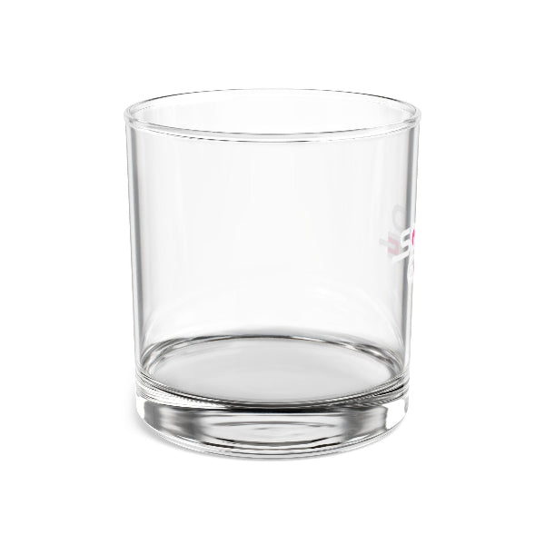 Clear glass tumbler with embossed design on a white background