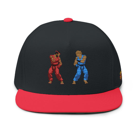 A black and red snapback cap featuring a pixel-art graphic of two martial artists on the front, one in red and one in blue, against a plain white background.