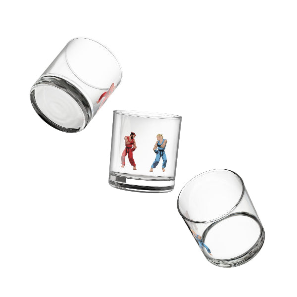 Set of three clear glass tumblers with printed designs on a white background