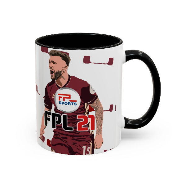 A white ceramic mug with a black handle and black interior, featuring a printed graphic of a football player in a maroon jersey with 'FPL SPORTS' and 'FPL 21' text.