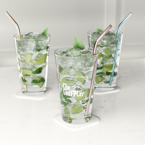 Three glasses of mojito with straws on a white surface