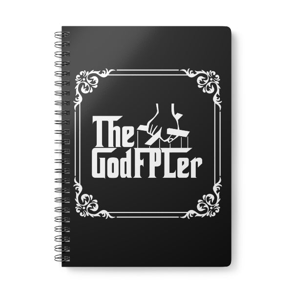 Black notebook with 'The GodFPLer' logo on a white background