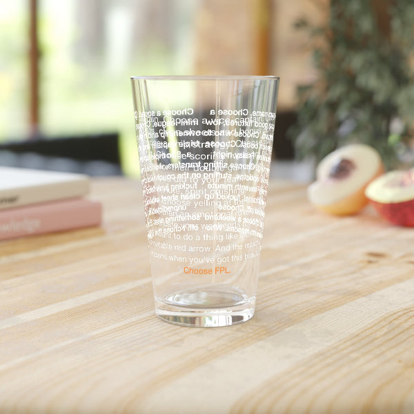 Clear glass with text on a wooden surface with a blurred background