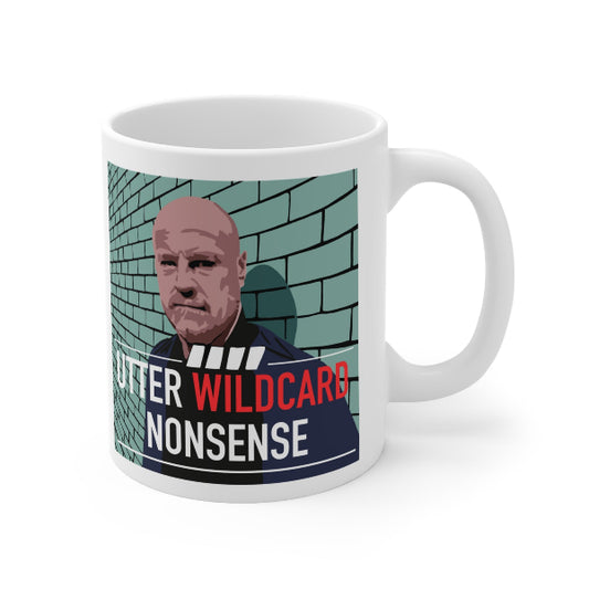 A white ceramic mug featuring a printed graphic of a bald man's portrait against a teal brick wall, with bold text reading 'UTTER WILDCARD NONSENSE' in red and white.